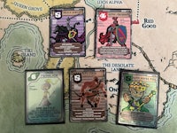 a group of cards on a map with different characters on them